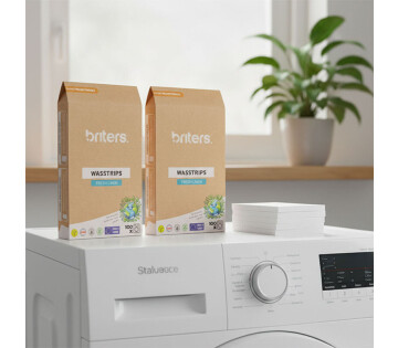 De 1+1 GRATIS Briters Wasstrips zonder bewaarblik staan op de wasmachine.