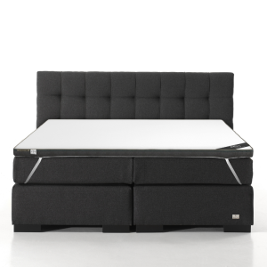 Een bed met daarop het Twin Motion&reg; Topdekmatras.